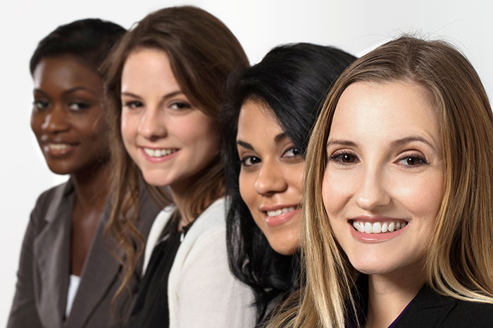 divers group of female leaders smiling